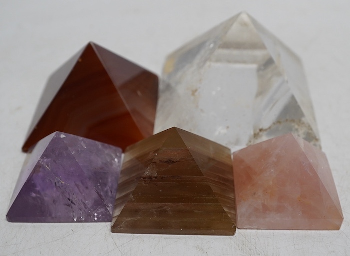 A collection of various carved stone ‘pyramids’ including rose quartz, tallest 4cm. Condition - fair